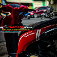 Tem trùm xe Vision đỏ cam